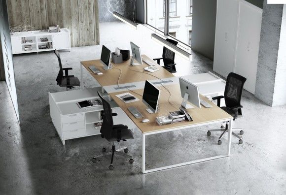 Modern office workspace with natural light, desk, and chair